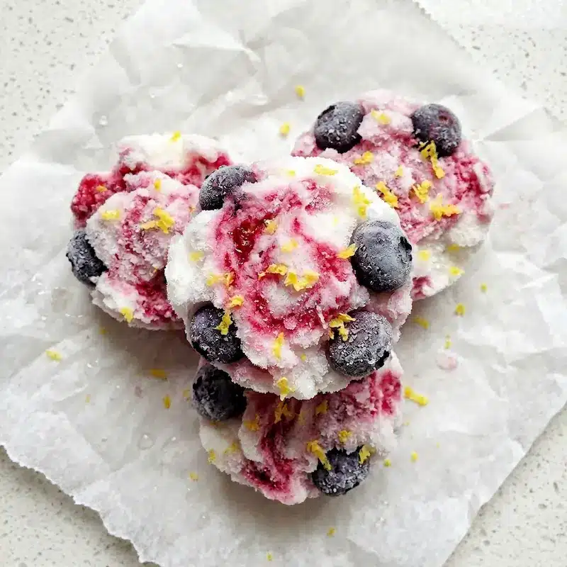 Viral TikTok No Sugar Yogurt Clusters Close-Up viral tiktok yogurt clusters recipe without added sugar with raspberry swirl and blueberries